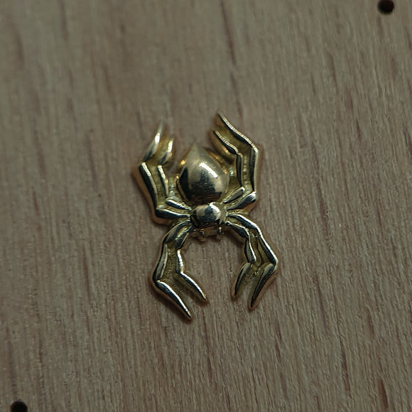 Ear piercing attachment in shape of a spider made of 14 karat yellowgold