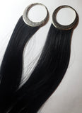 big gauge earrings with long black synthetic hair and a tatami mat pattern on the crescent shaped hoops